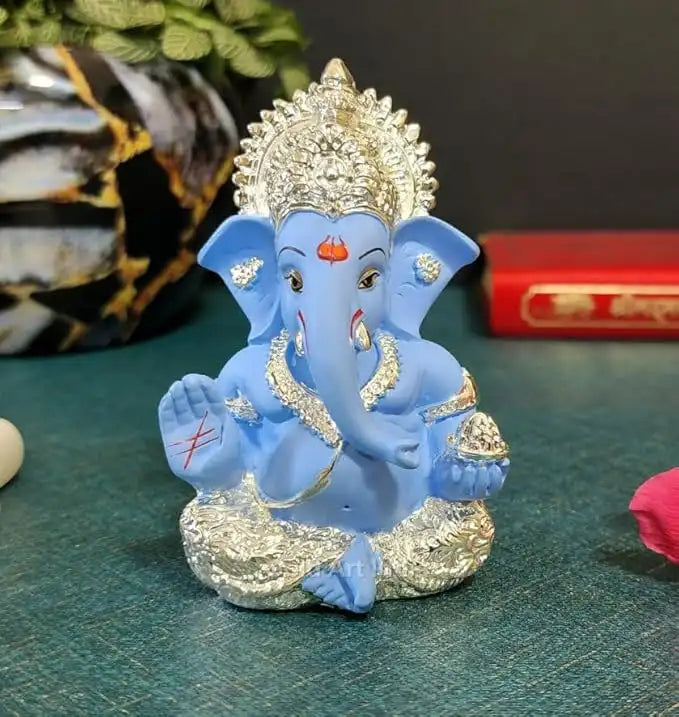Silver plated Ganesha idol with Sky Blue terracotta finish, ideal for home and office decor, perfect gift for any occasion.