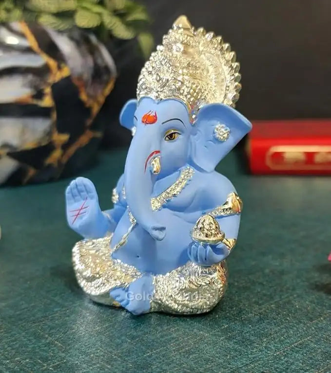 Silver plated Ganesha idol with Sky Blue terracotta finish, ideal for home and office decor, perfect gift for any occasion.
