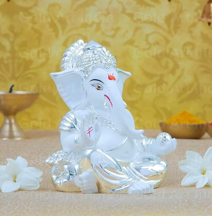 Silver plated Ganesha idol with terracotta finish, perfect for home and car decor.