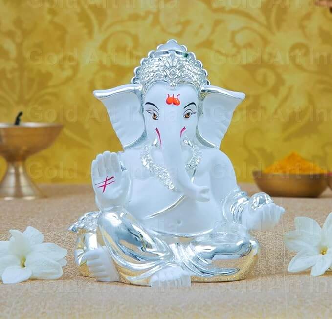 Silver plated white terracotta Ganesha idol, 3.5 inches, ideal for home decor and gifting during festivals.