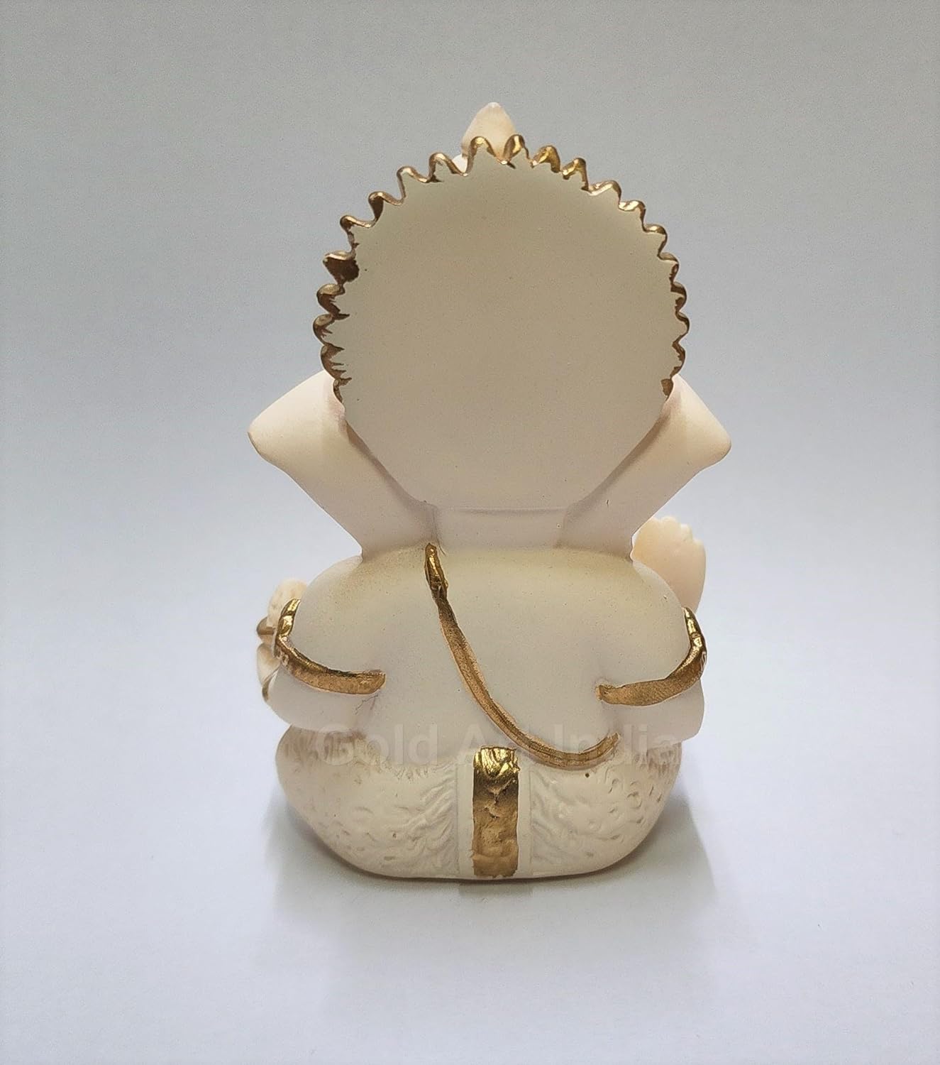 Compact Ganesha idol for car dashboard – rear and base finish.