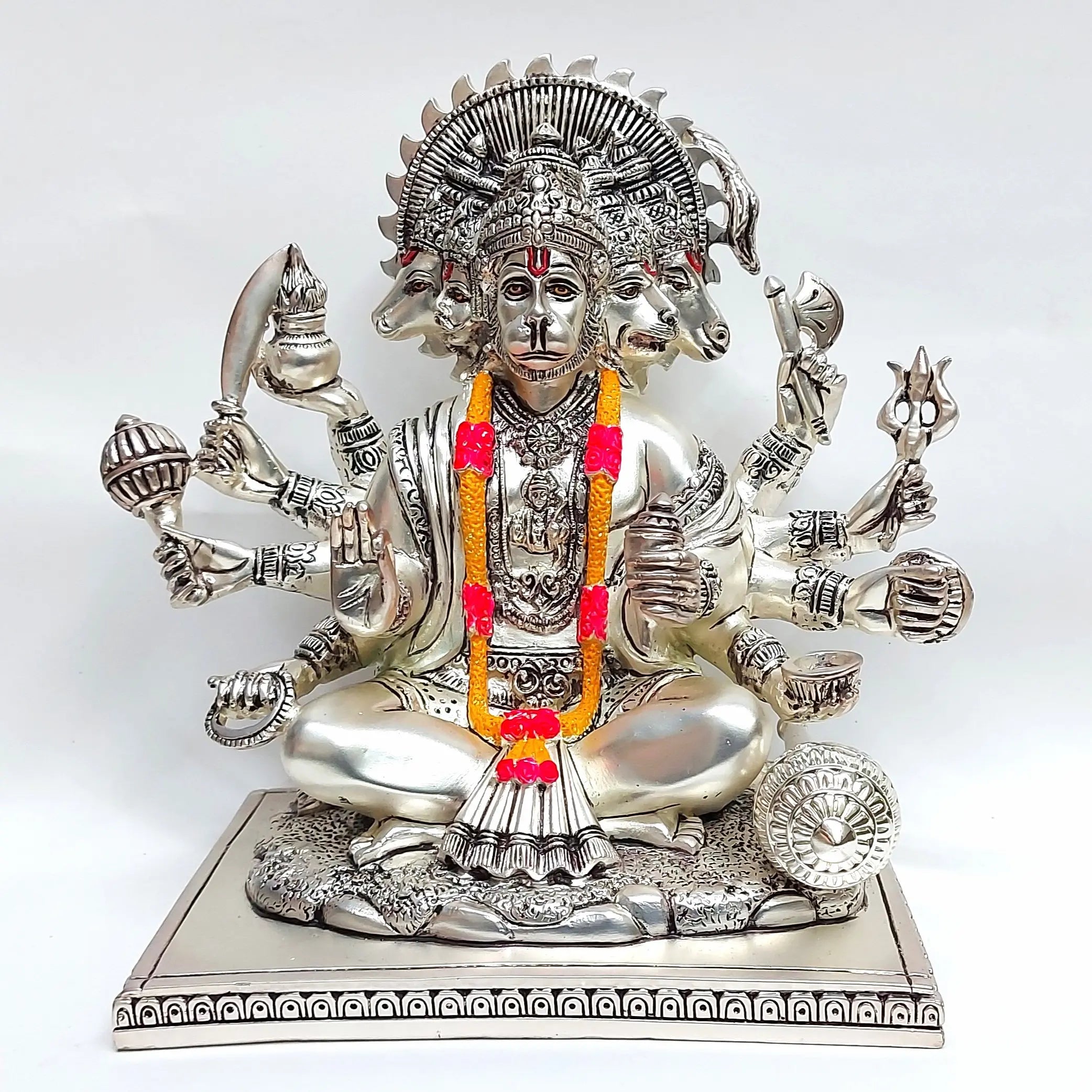 Front view of silver plated Panchmukhi Hanuman idol with detailed carving, five faces, and garland decoration