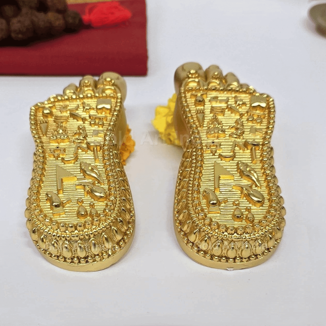 Shri Laxmi Charan Paduka gold plated feet idol with intricate designs for home temple decor.