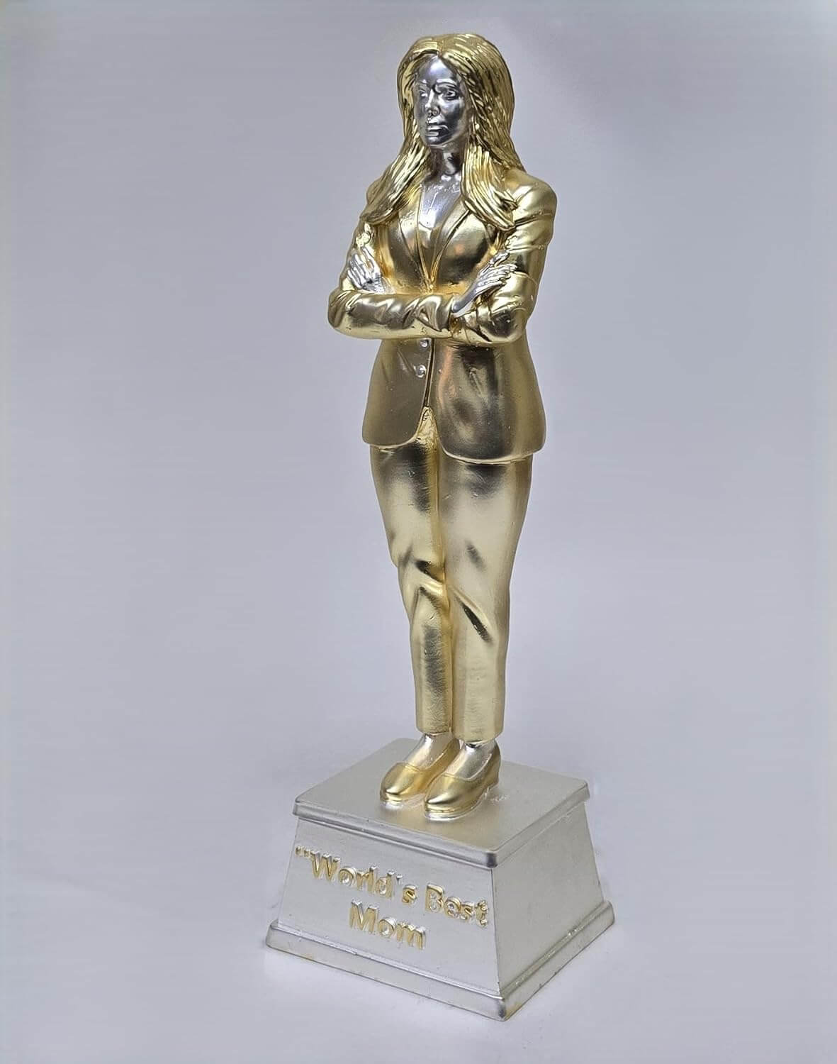 Elegant gold and silver 'World’s Best Mom' trophy featuring a confident woman in a business suit with arms crossed, symbolizing strength, leadership, and appreciation for mothers. A perfect gift for Mother's Day or special occasions.
