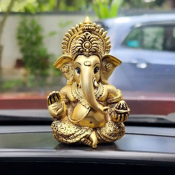Gold plated Ganesha idol placed at a home entrance for Vastu blessings