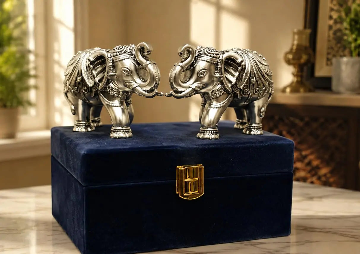 Silver plated elephant pair angled view