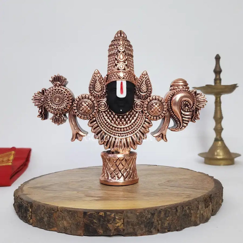 Antique copper-finish Lord Balaji idol with black face on wooden base