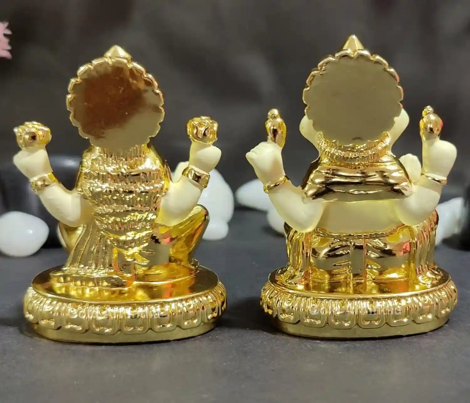 Rear view of Lakshmi and Ganesha idols, showing gold plated off-white detailing and decorative pedestal design.