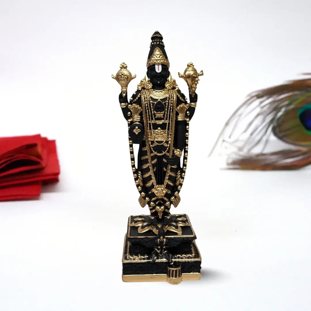 Black and gold  Plated Lord Venkateshwara idol, intricately detailed with ornate jewelry and traditional symbols, standing on a decorated pedestal.