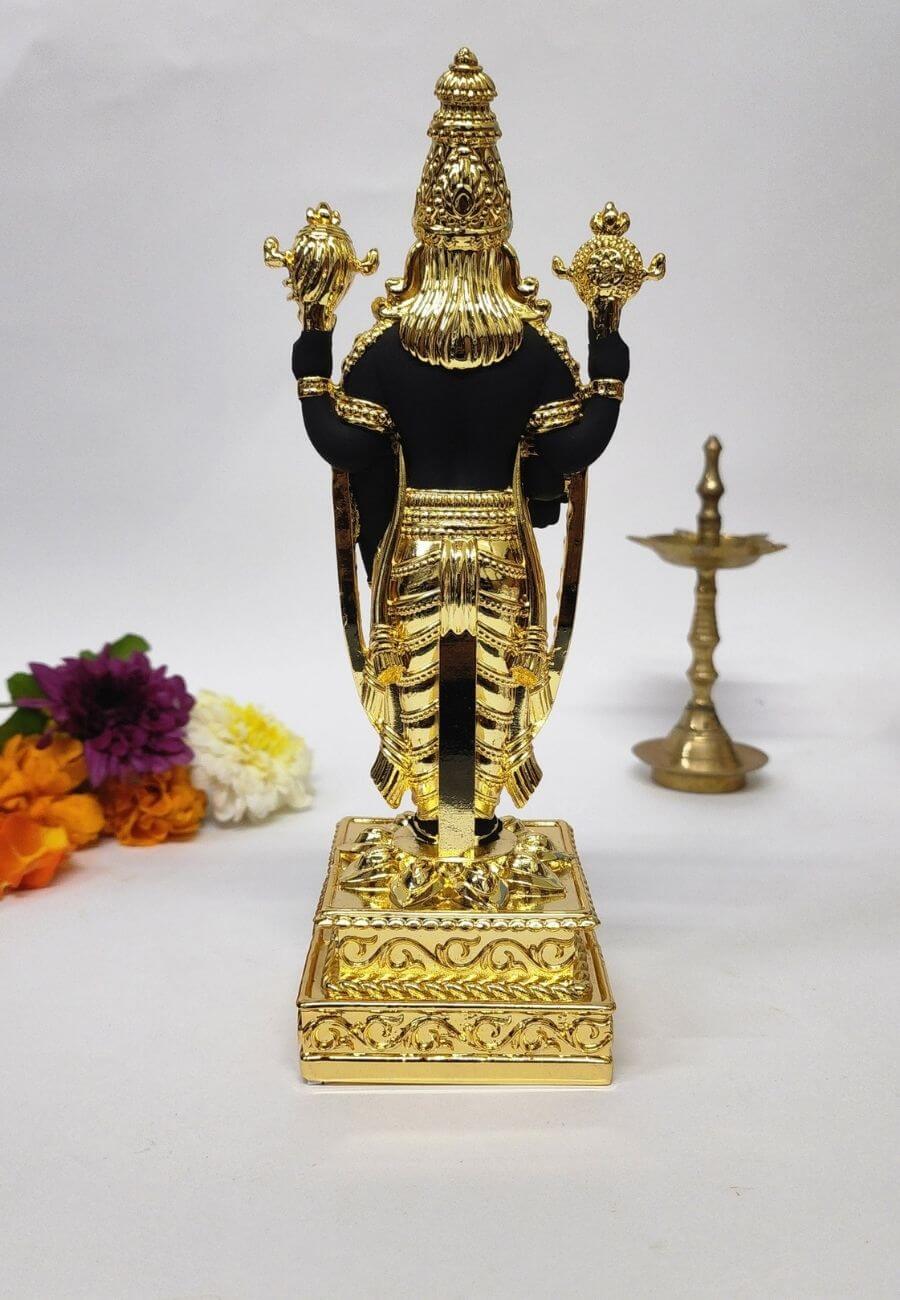 Black and gold  PlatedLord Venkateshwara idol, intricately designed with detailed golden embellishments, standing on an ornate pedestal.