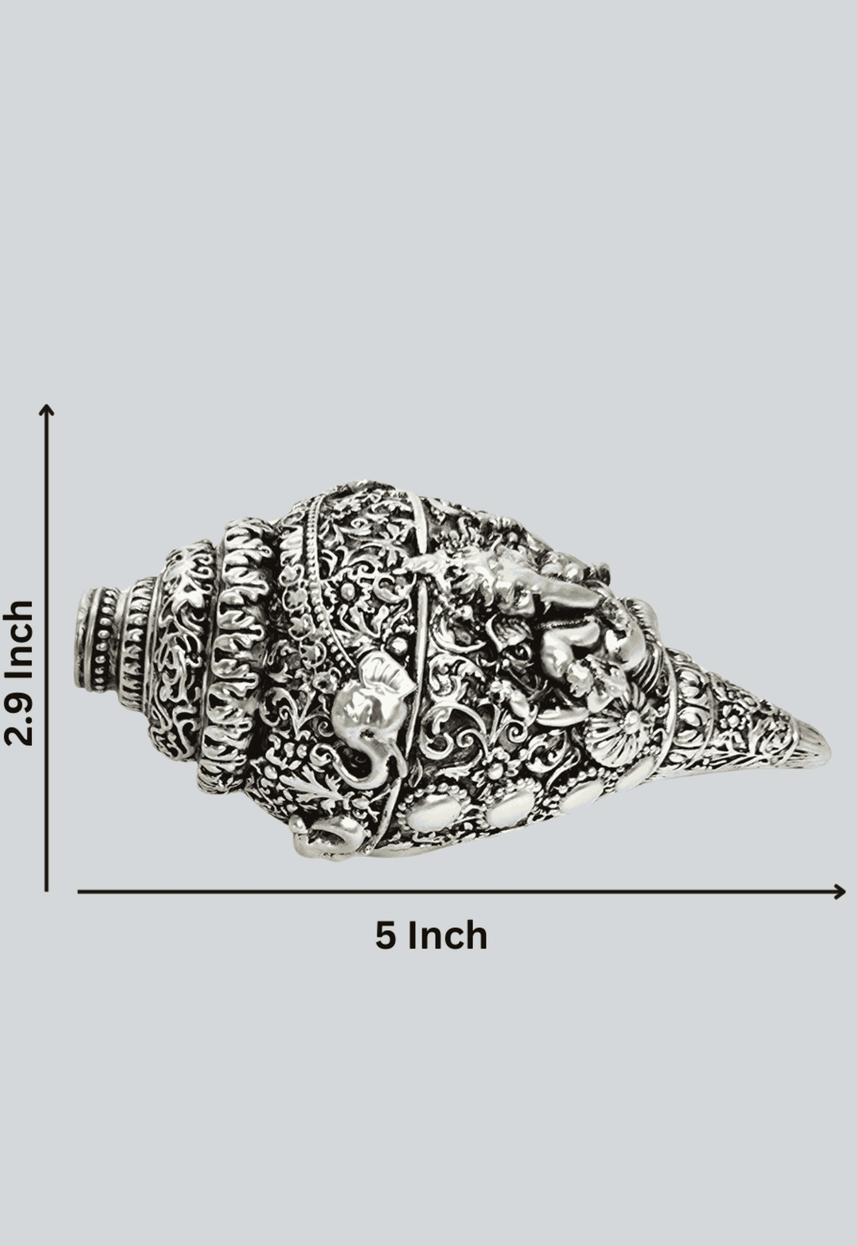 Ornate silver-plated conch shell (shankha) with a detailed carving of Lord Ganesha  Dimentions 2 x 5 x 2.4 inches