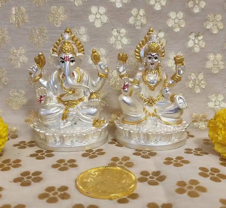 Close-up view of Silver-Plated Lakshmi and Ganesha idols with intricate matte finish detailing

