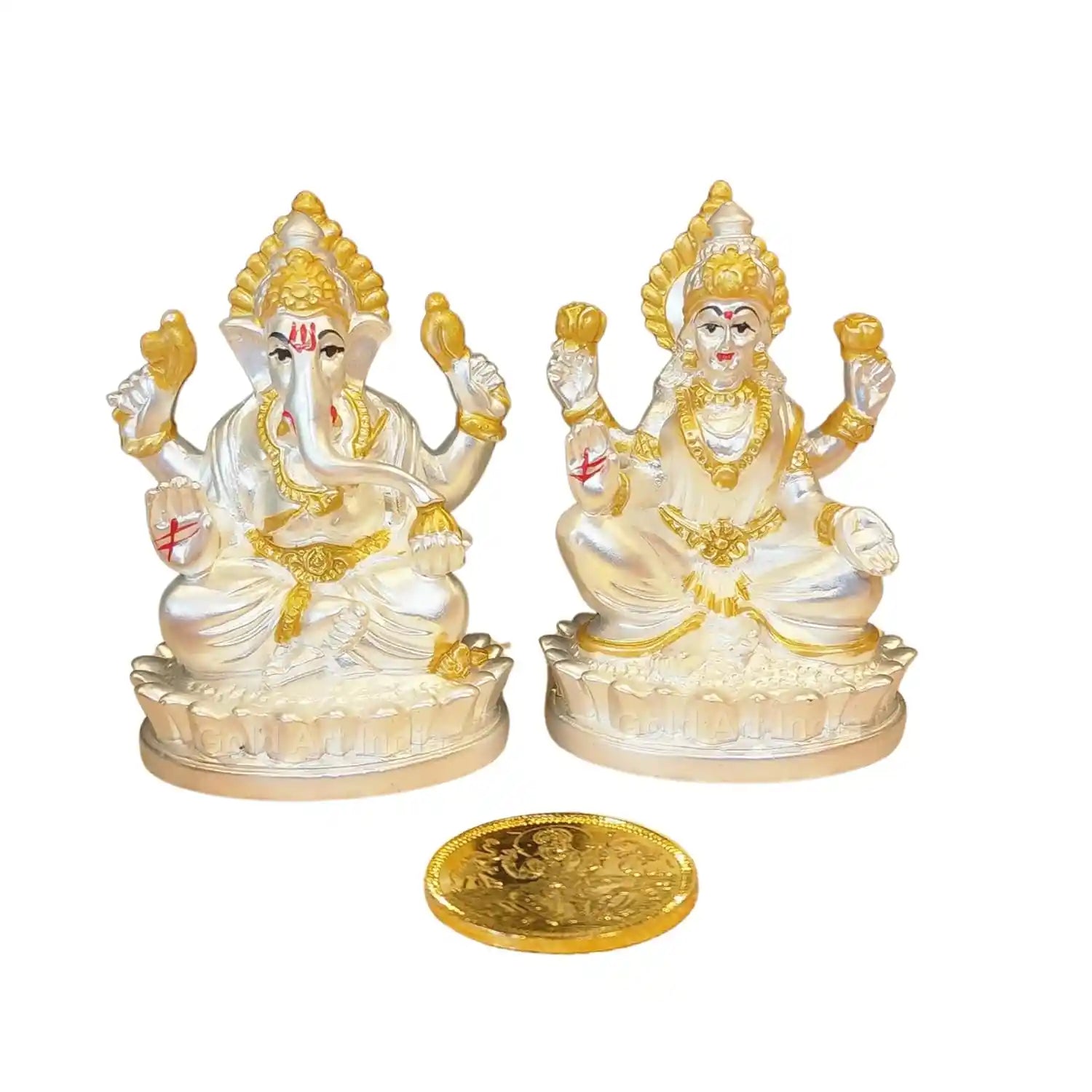 Artistic angled view of Silver-Plated Lakshmi and Ganesha idols with gold-plated coin, handcrafted with matte elegance 
