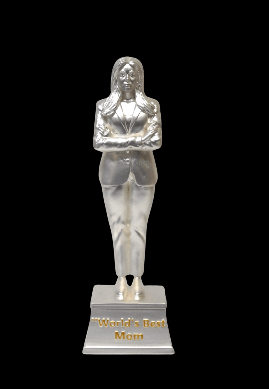 A silver Plated matte finish "World's Best Mom" trophy featuring a woman in a suit with arms crossed.