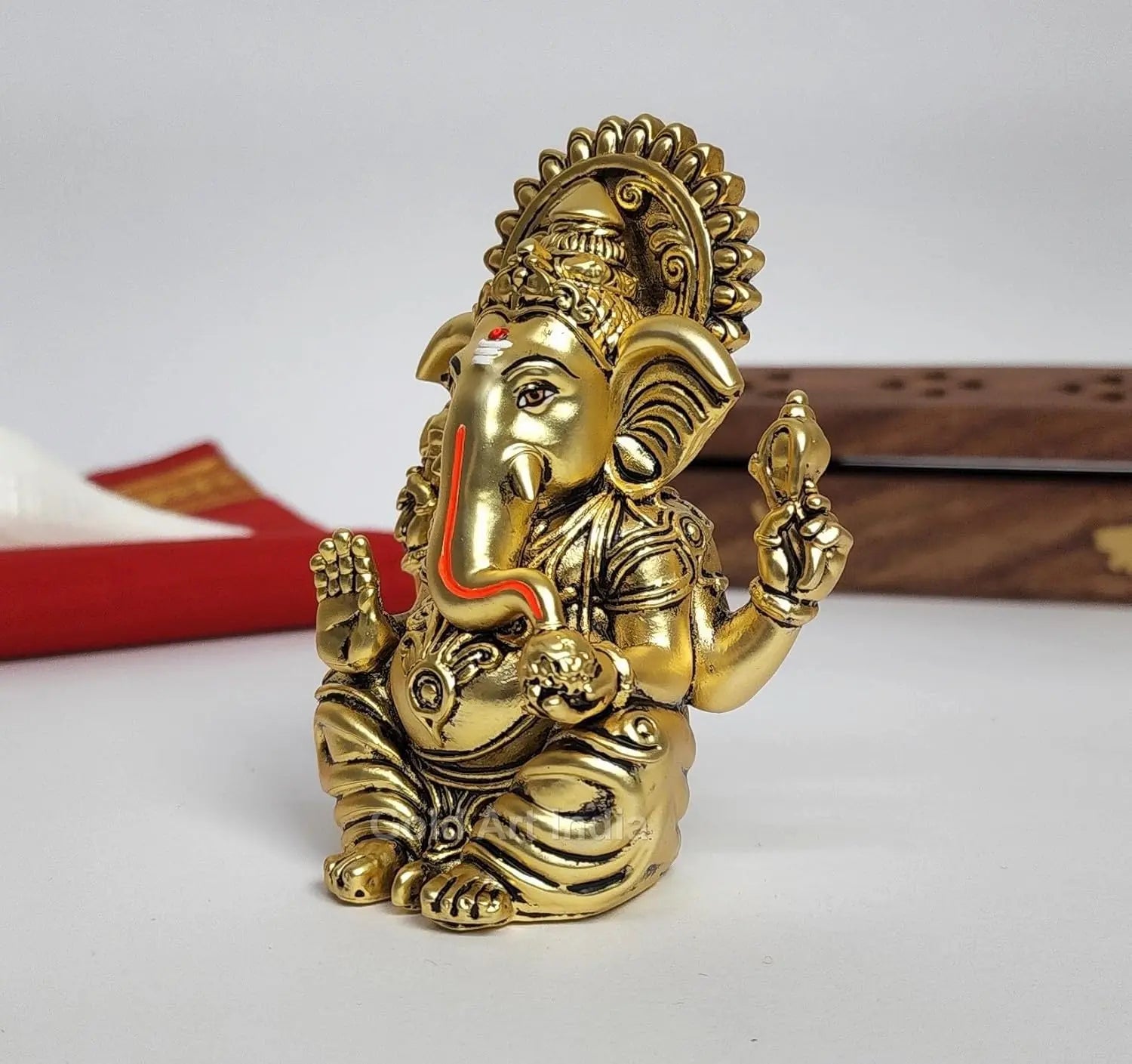 small ganesh idol for car dashboard – gold art india side image