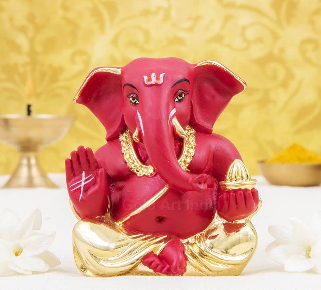 Gold plated red terracotta finish Ganesha idol, perfect for home and office decor or as a thoughtful gift.