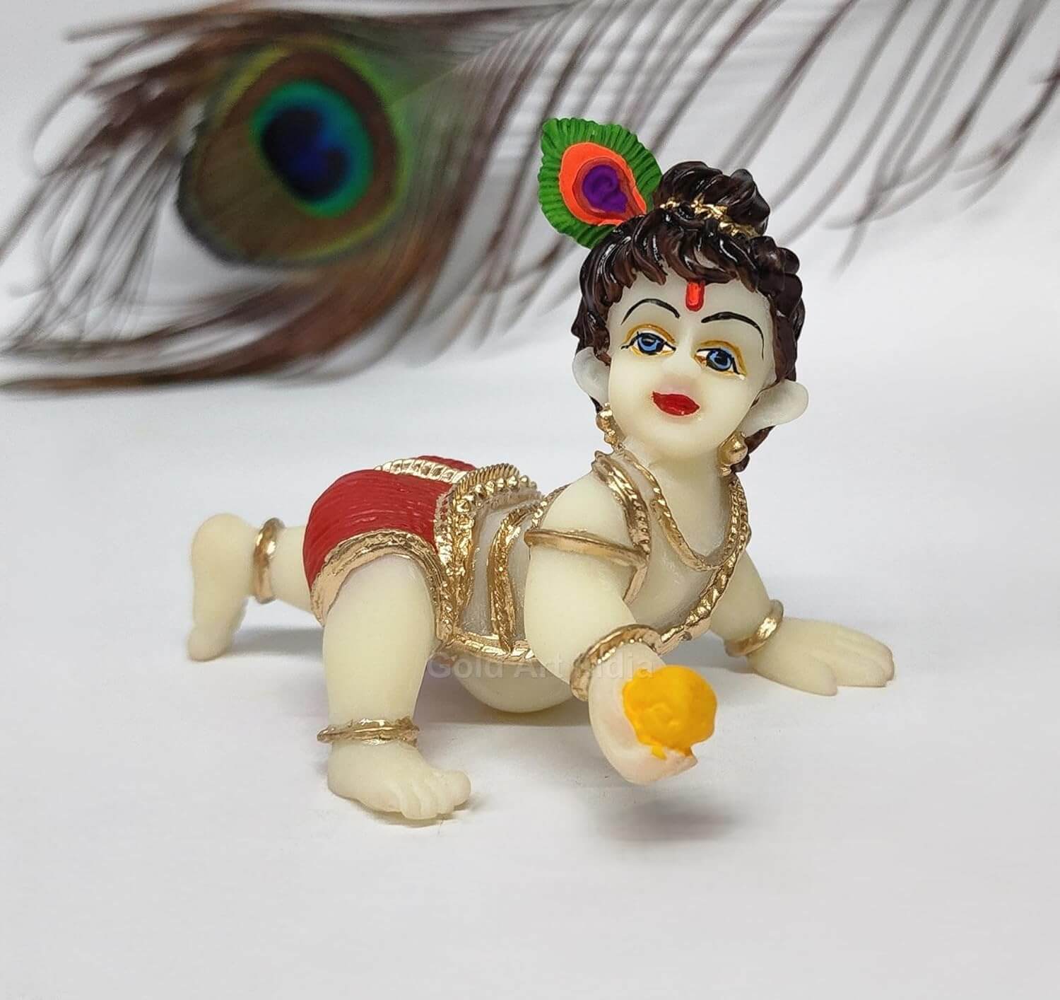 Ivory Laddu Gopal idol crawling with red dhoti, intricate details, perfect for home decor and gifting.