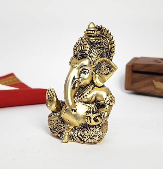 ganesha idol holding modak Gold Plated Antique Matte look compact size left look