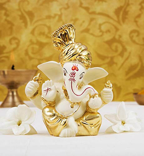 Gold plated off-white Ganesha idol perfect for home decor, gifting, and festive celebrations.