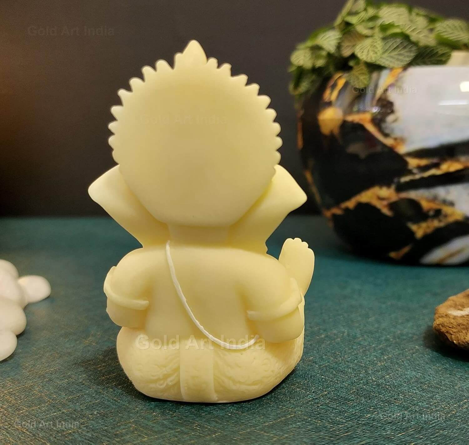 Ivory finish Ganesha idol back view, crafted from solid poly resin, 3.5 inches tall, perfect for home decor and gifting.
