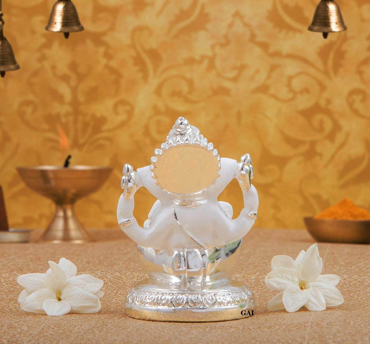 Silver plated Ganesha idol on a decorative base, perfect for car, home, or office decor, and ideal as a thoughtful gift.