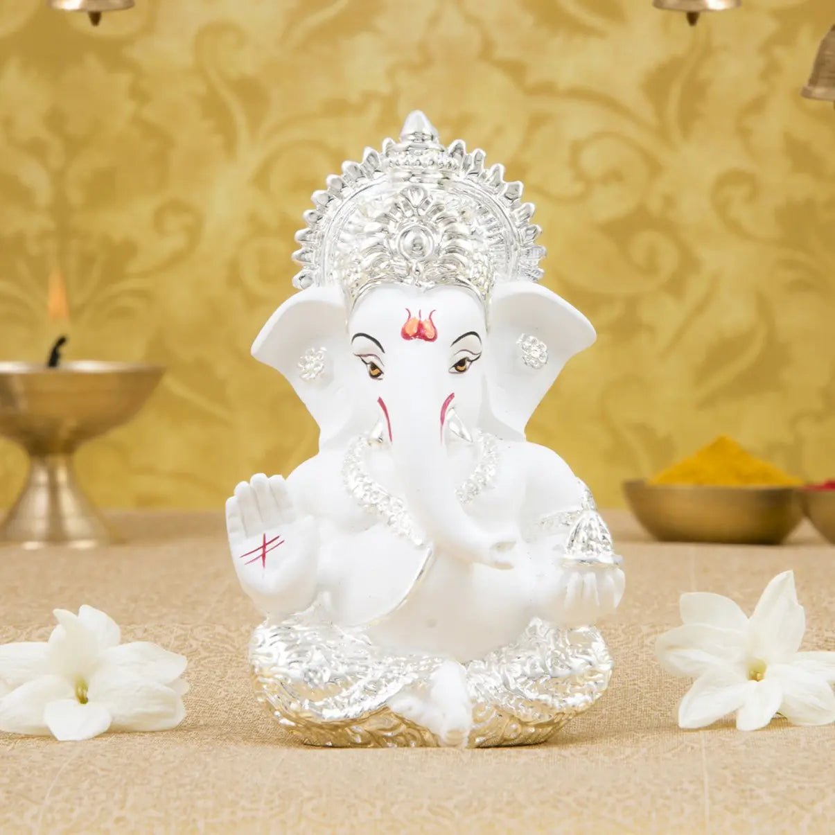 Silver plated Ganesha idol with terracotta finish, ideal for home and office decor, perfect gift for any occasion.