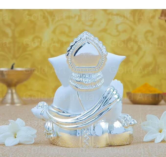 Silver plated white terracotta Ganesha idol for home decor, gifts, and festivals, 3.5 inches tall.