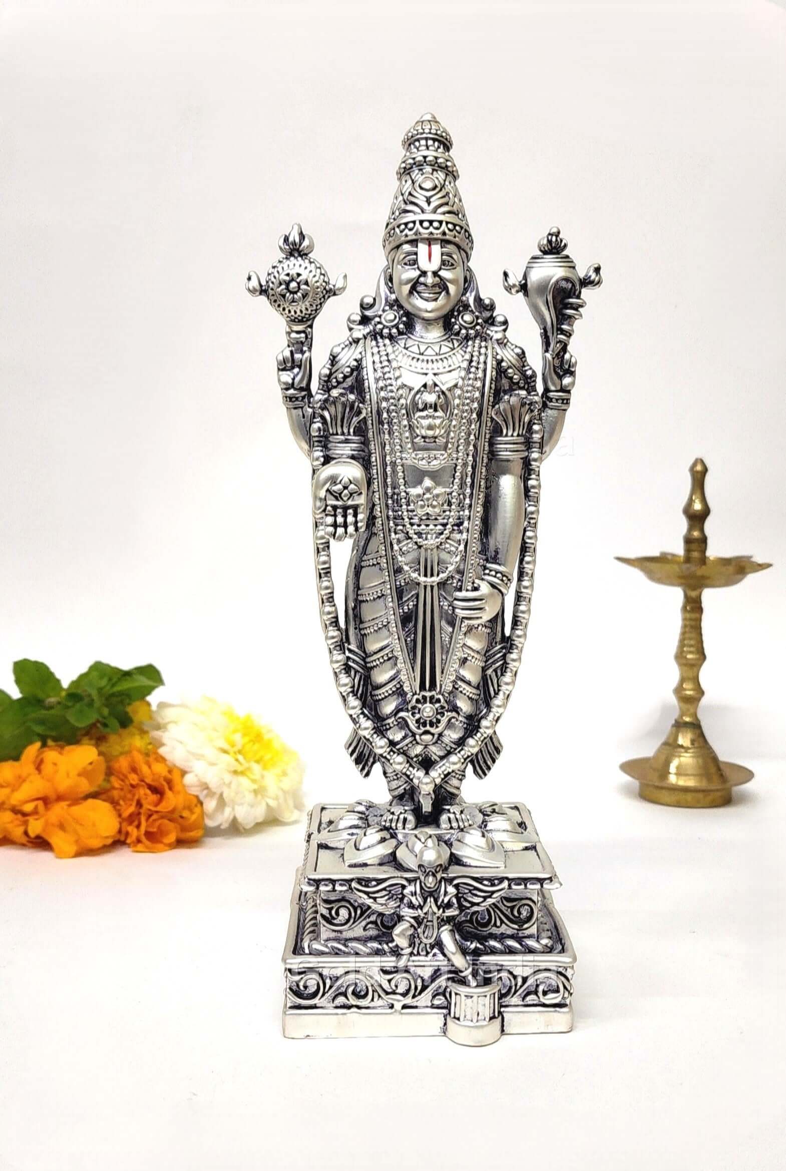 A 5.1-inch silver Plated idol of Lord Vishnu, intricately designed, standing on a decorated pedestal with divine ornaments and symbols.
