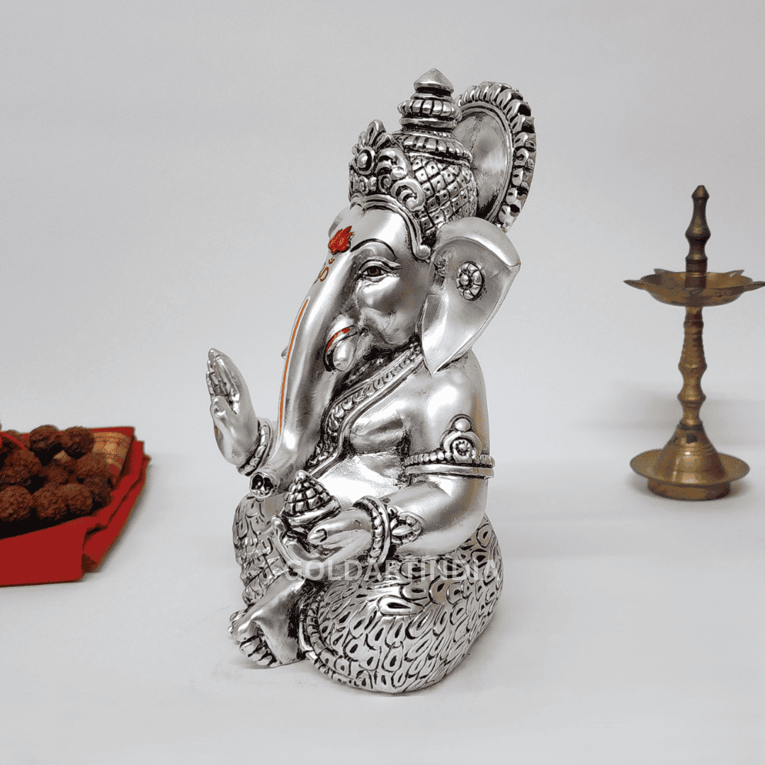 Elegant 7-inch Silver Antique Mukut Ganesh Idol for pooja and decor, showcasing fine detailing and traditional design.