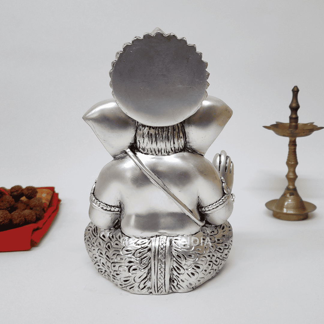 Back view of Silver Antique Mukut Ganesh Idol, showcasing intricate details and traditional design for pooja and decor.