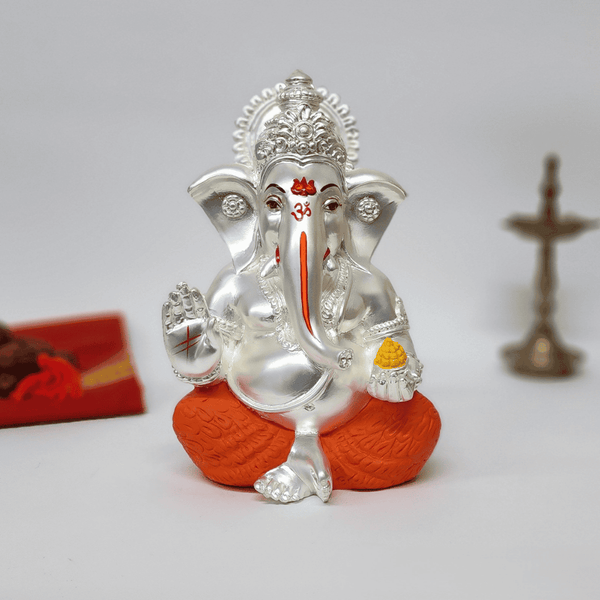 Silver Matte Ganesha Idol – 7 Inch | Orange Dhoti & Ladoo | Home Decor